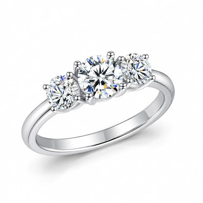 Round moissanite three-stone engagement ring angled view in silver