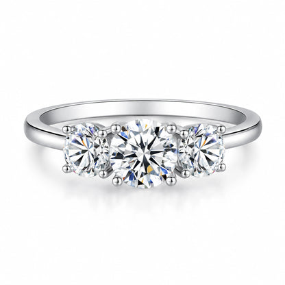 Round moissanite three-stone engagement ring front view in silver