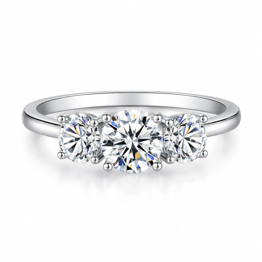 Round moissanite three-stone engagement ring front view in silver